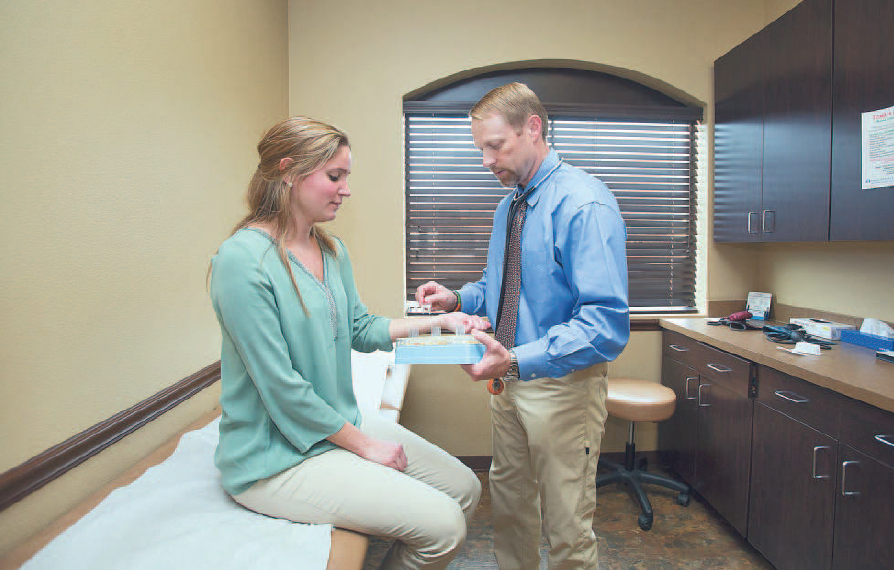 Dr. Jay L. Gruhlkey, right, demonstrates an allergy test with Physician Assistant Jan Dubensky at Lonestar Medical on Tuesday, Dec. 2016